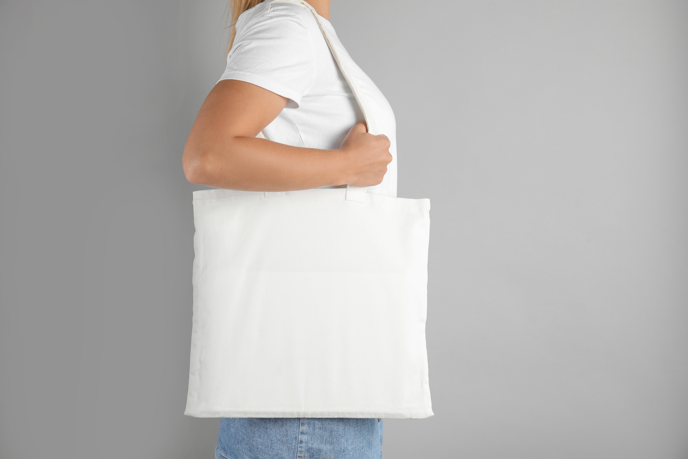 Woman with Tote Bag on Grey Background. Mock up for Design